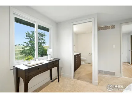 an aerial view of residential house with outdoor space and trees all around