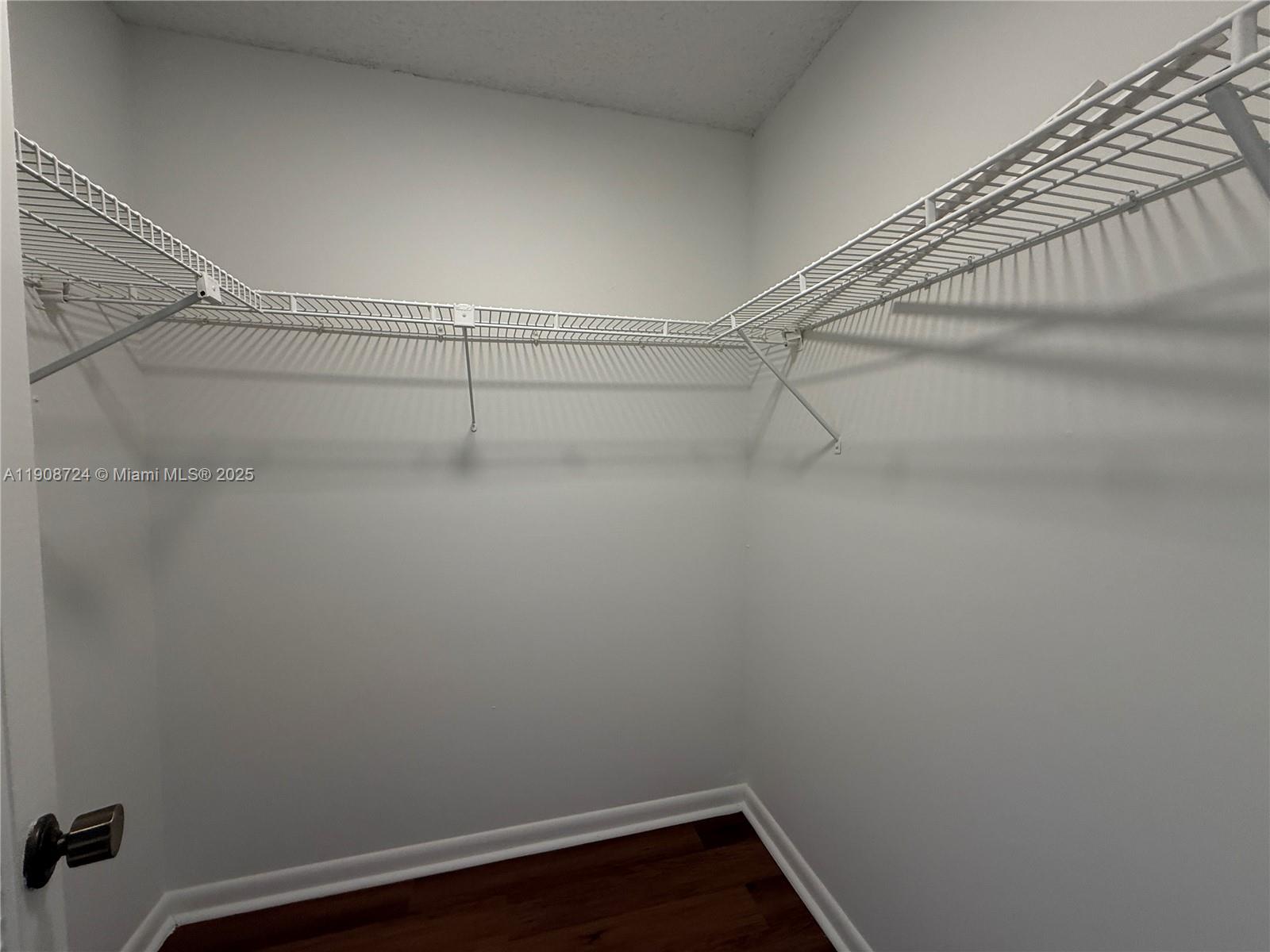 8900 West Sample Road, Unit 204 Coral Springs, FL 33065 - Photo 15 of 21 a view of a room with racks on the wall