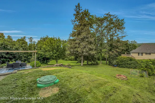 a backyard of a house with lots of green space