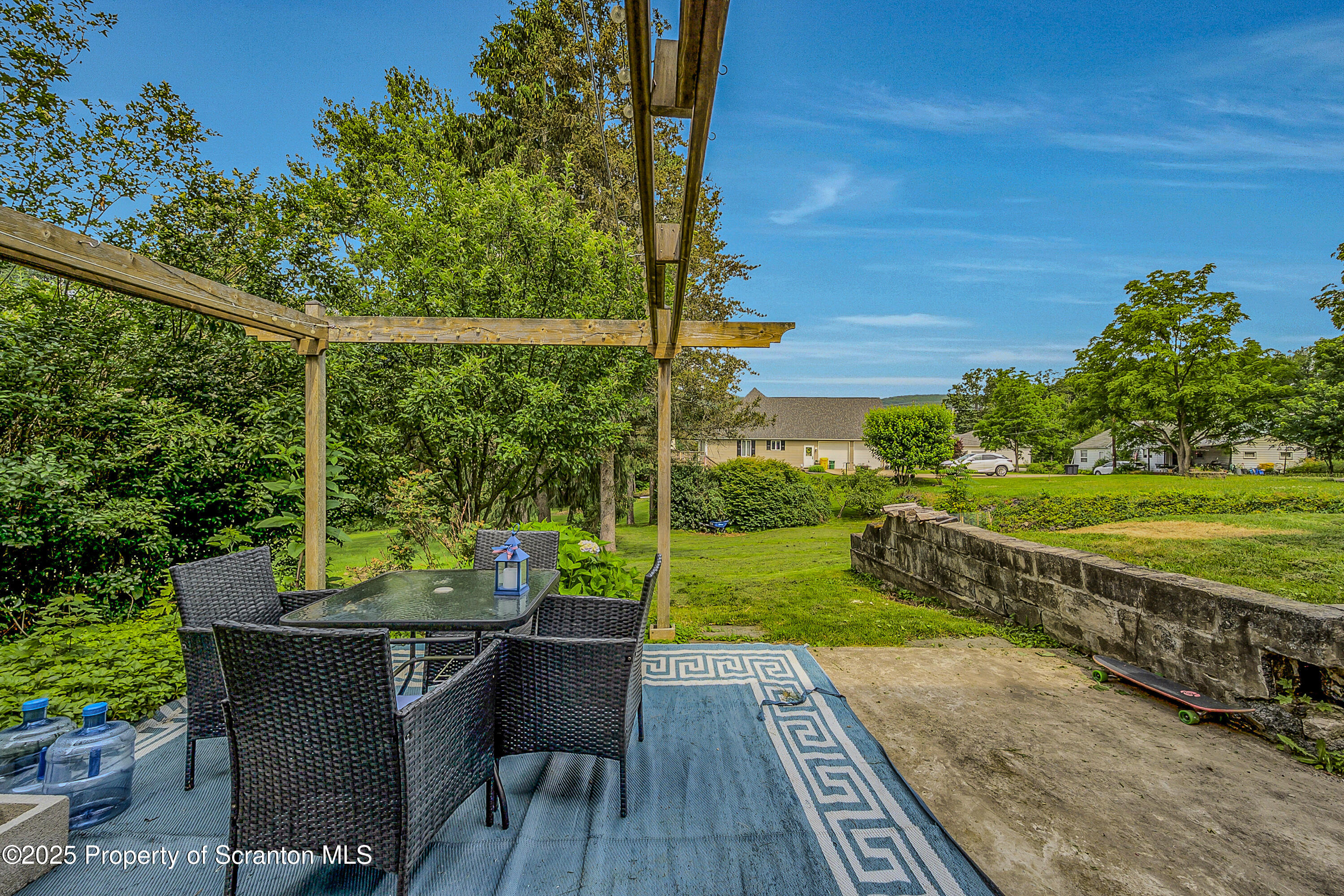 723 Chestnut Street Eynon, PA 18403 - Photo 12 of 34 a view of a chairs and table in patio with a yard