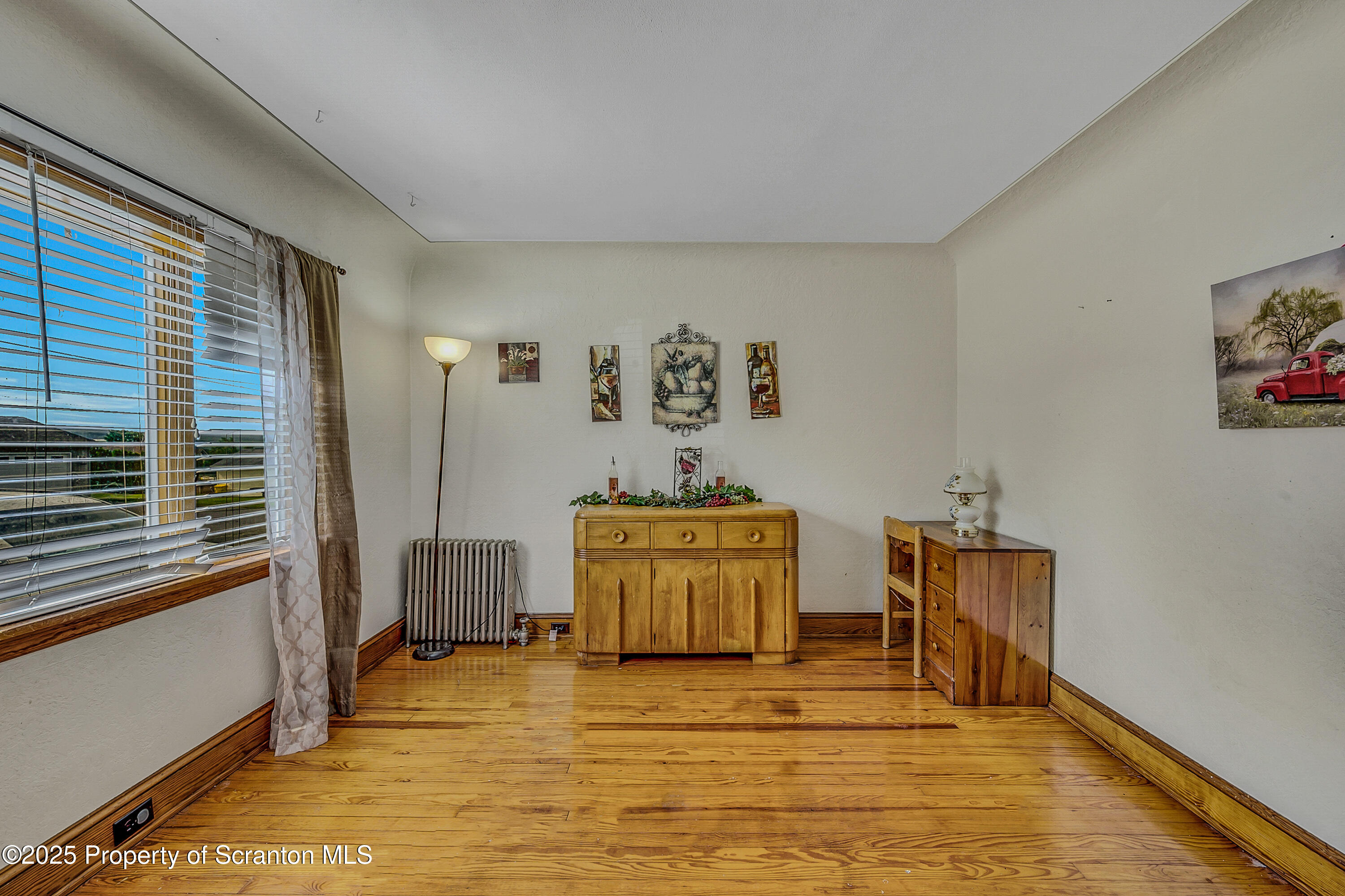 723 Chestnut Street Eynon, PA 18403 - Photo 18 of 34 a room with furniture and window