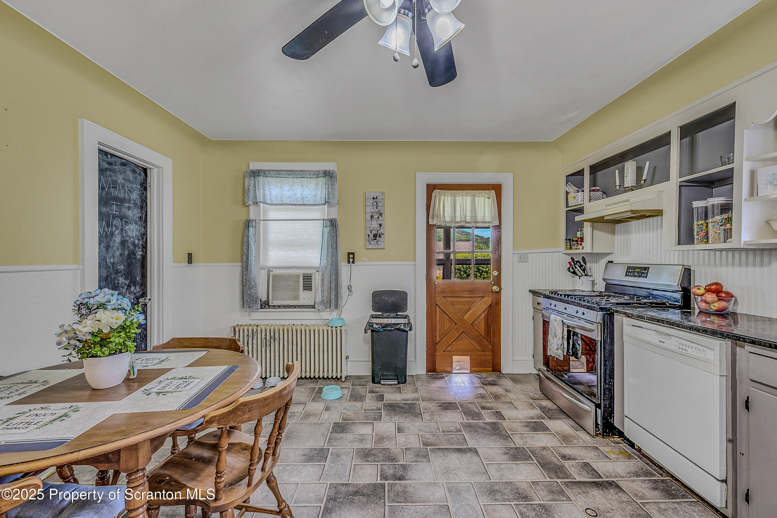 723 Chestnut Street Eynon, PA 18403 - Photo 19 of 34 a kitchen with stainless steel appliances granite countertop a stove refrigerator and cabinets
