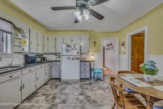 a kitchen with a sink and refrigerator