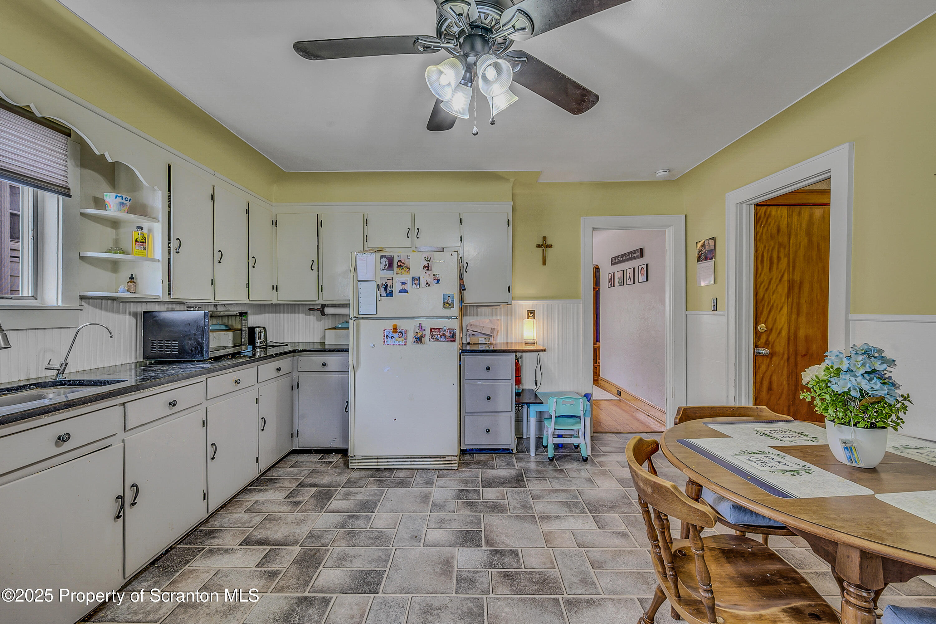 723 Chestnut Street Eynon, PA 18403 - Photo 20 of 34 a kitchen with a sink and refrigerator