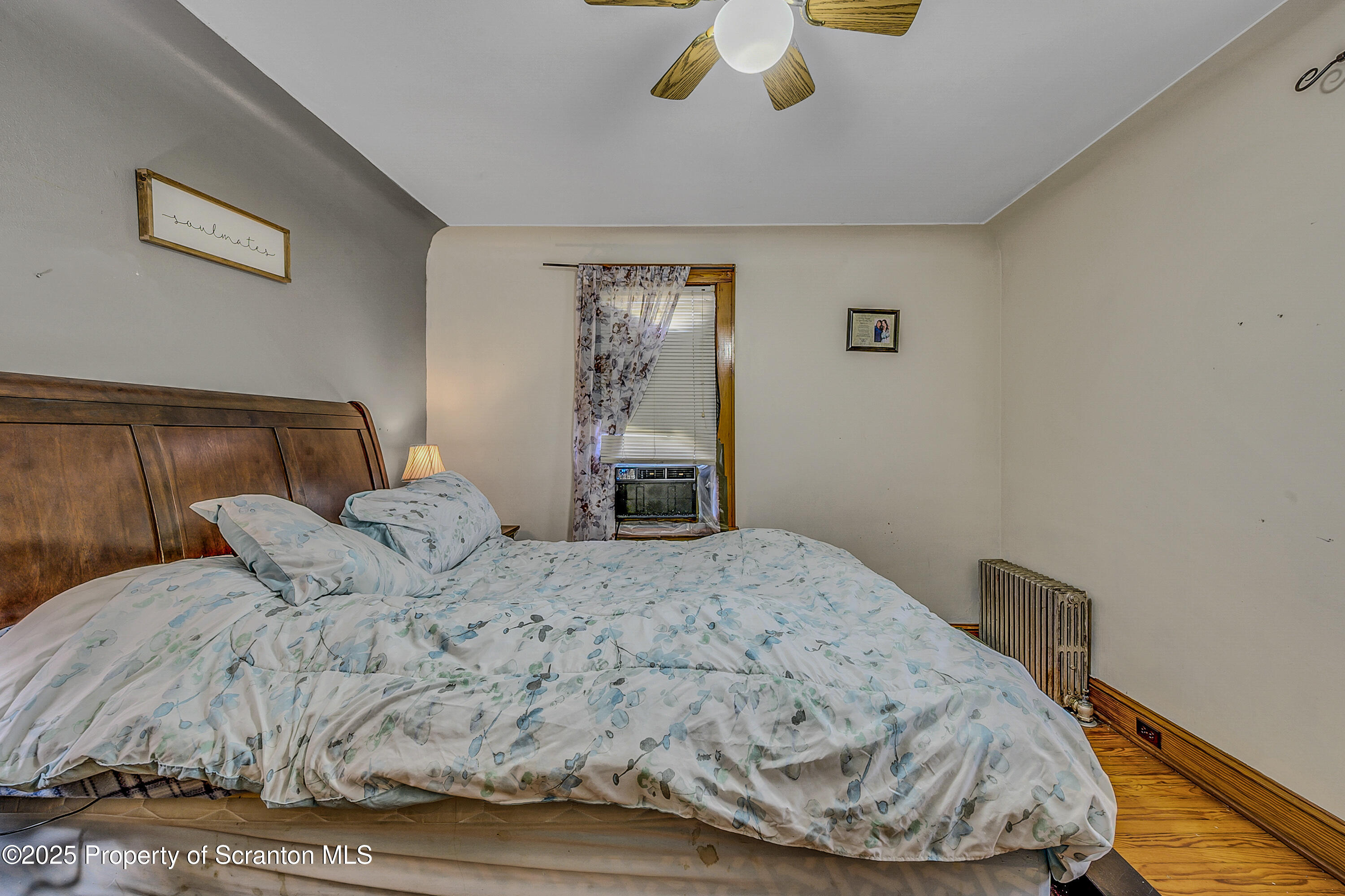 723 Chestnut Street Eynon, PA 18403 - Photo 21 of 34 a bedroom with a bed and a window