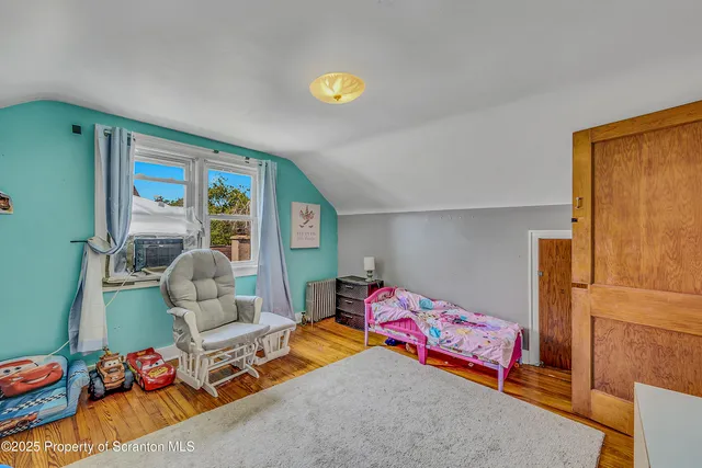 a view of a room with wooden walls