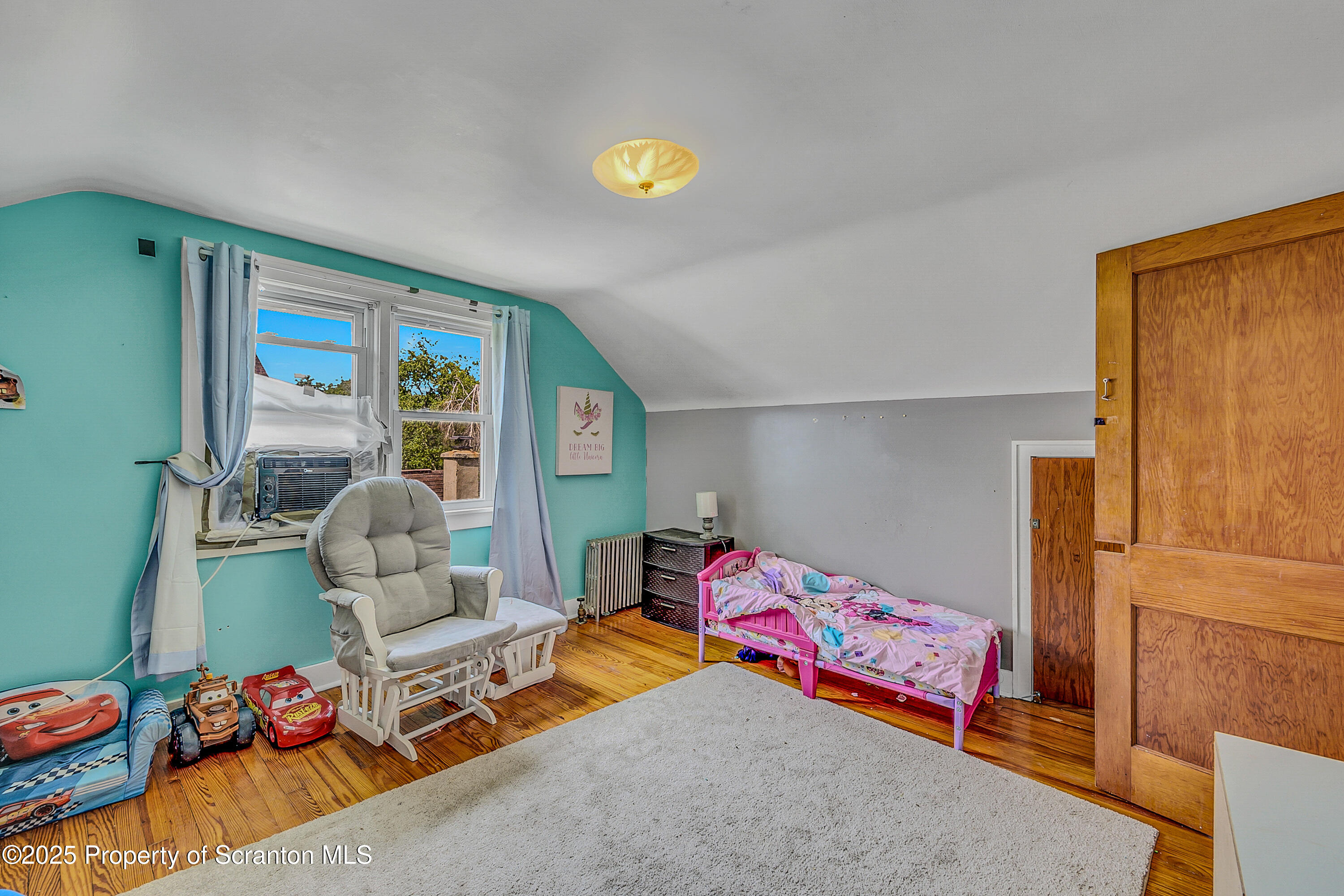 723 Chestnut Street Eynon, PA 18403 - Photo 30 of 34 a bedroom with furniture and a window