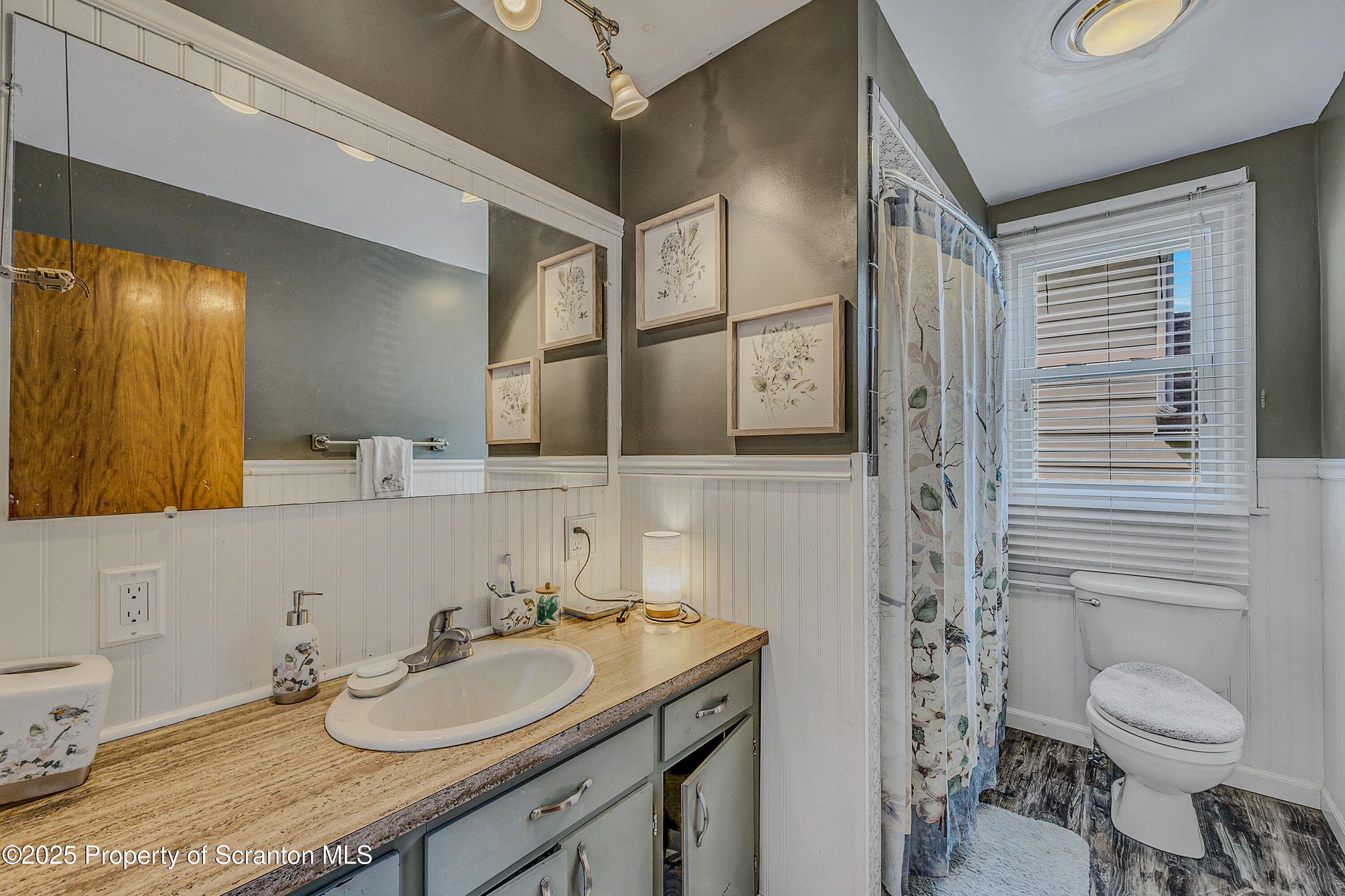 723 Chestnut Street Eynon, PA 18403 - Photo 4 of 34 a bathroom with a granite countertop sink toilet and shower