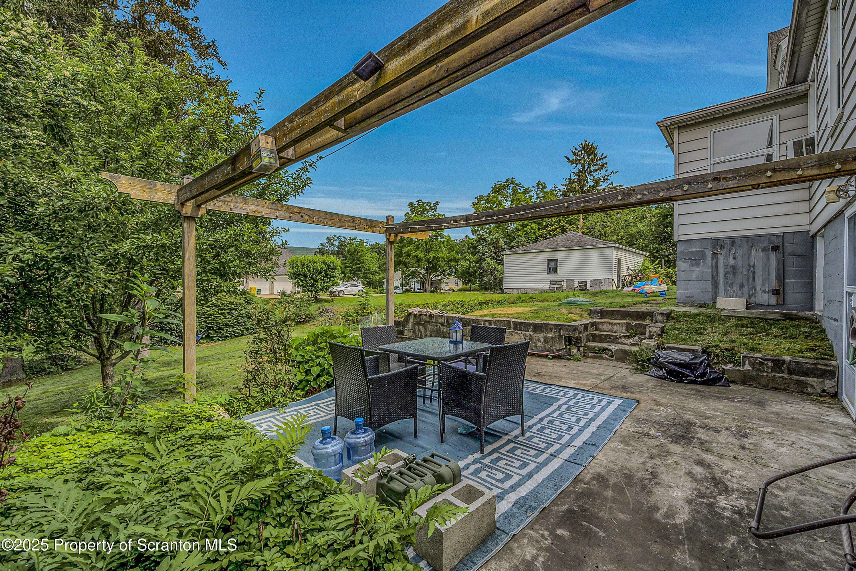 723 Chestnut Street Eynon, PA 18403 - Photo 8 of 34 a view of a backyard with sitting area