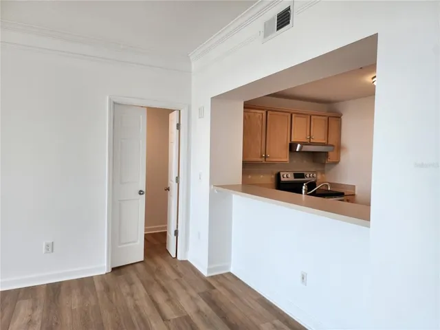 a bathroom with a sink mirror and shower
