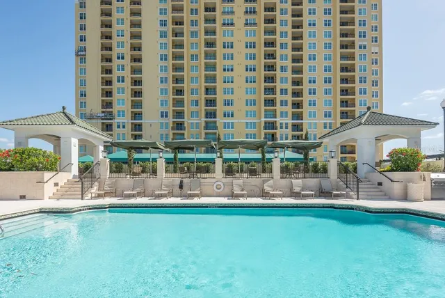 a lobby with a table and chairs