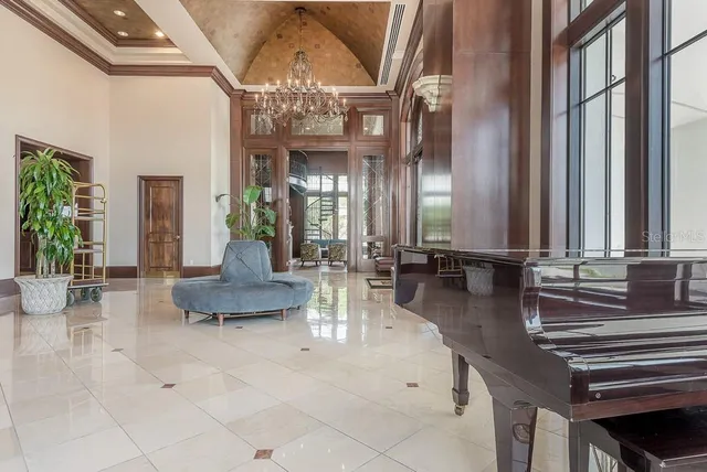 a view of swimming pool with outdoor seating and plants