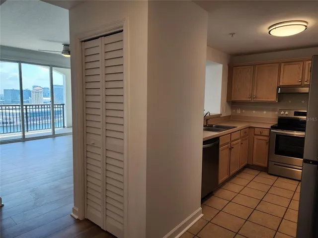a kitchen with a stove cabinets and a kitchen counter space