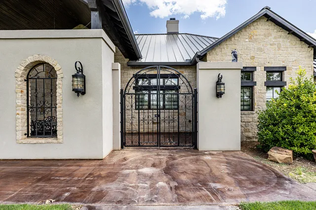 a bathroom with a granite countertop shower a toilet and a sink