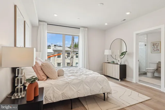 a bedroom with a bed and a chair