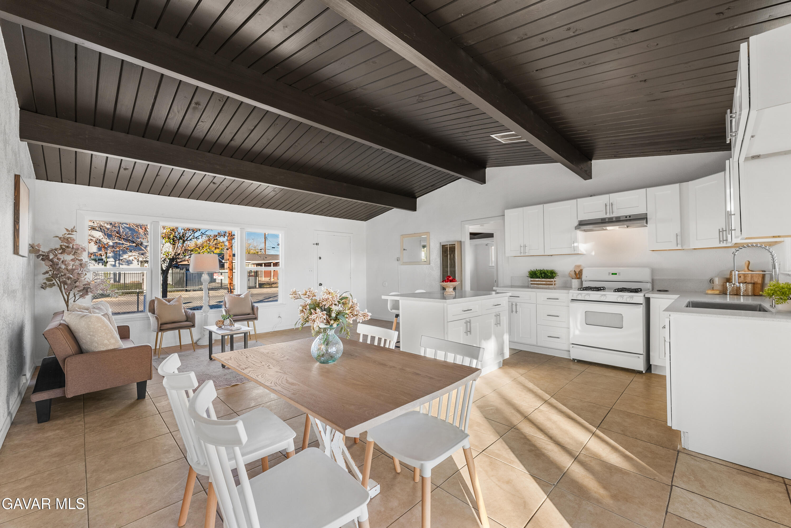 38640 Larkin Avenue Palmdale, CA 93550 - Photo 11 of 38 a kitchen with stainless steel appliances kitchen island granite countertop lots of table and chairs