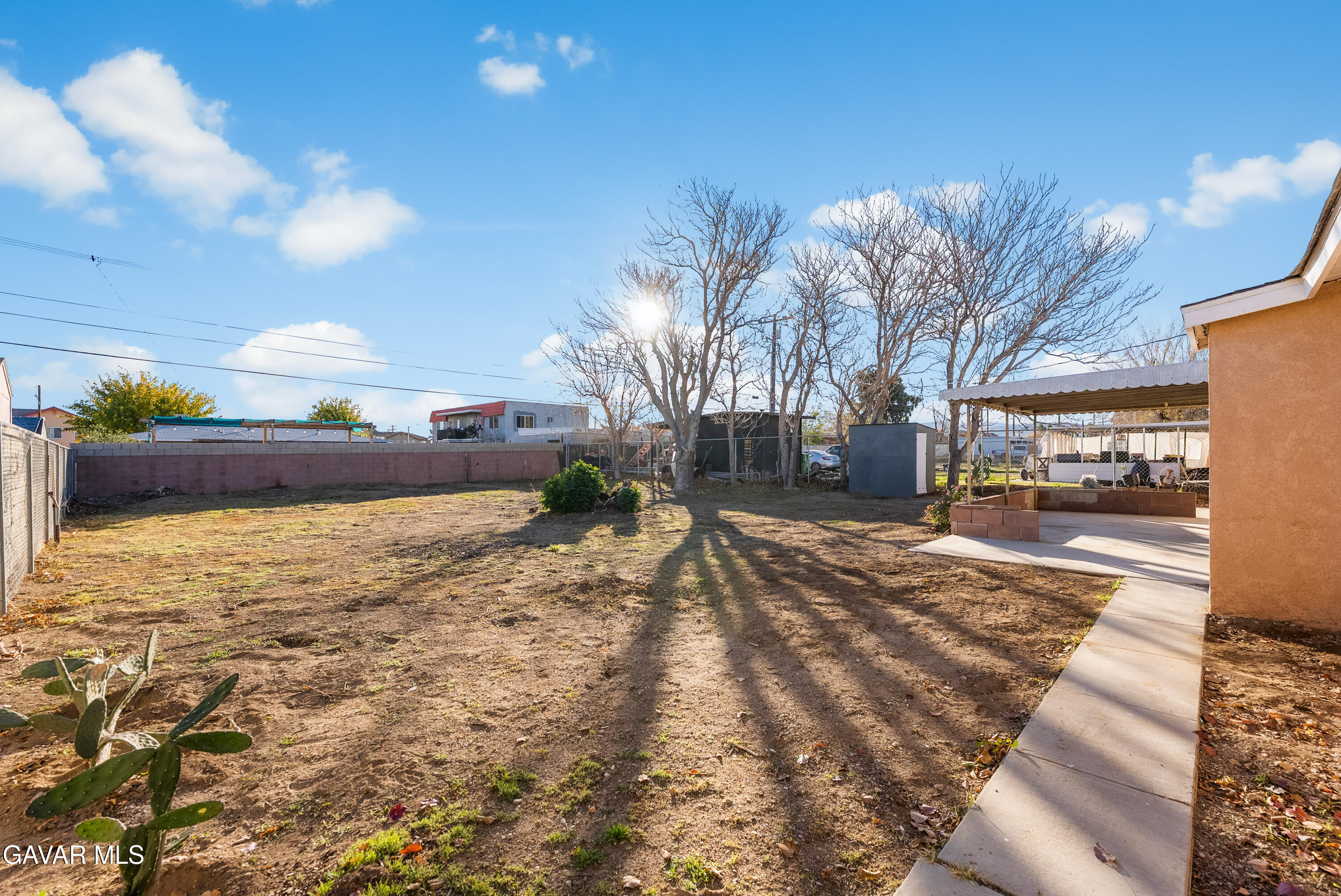 38640 Larkin Avenue Palmdale, CA 93550 - Photo 14 of 38 a view of a yard with a house in the background