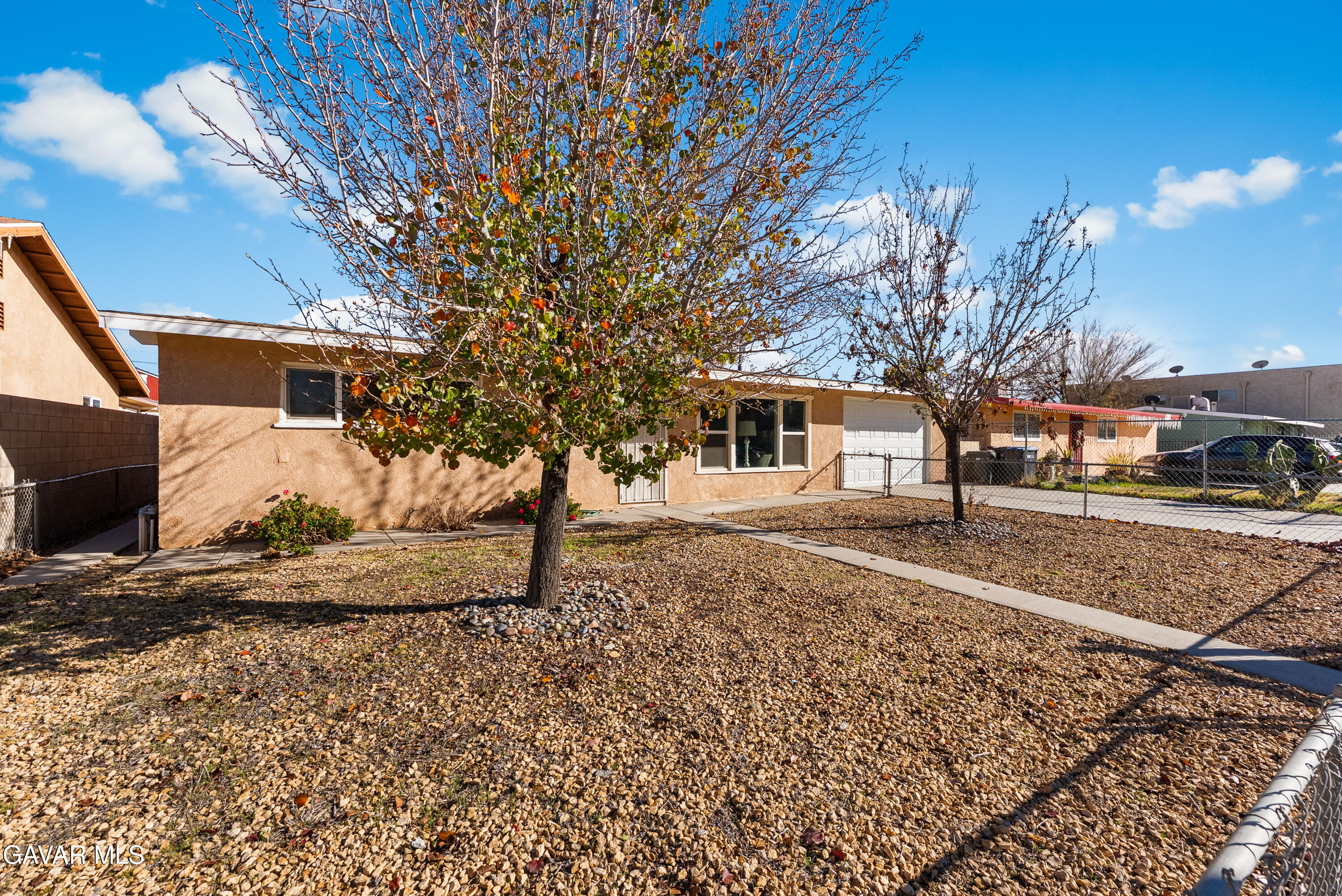38640 Larkin Avenue Palmdale, CA 93550 - Photo 19 of 38 a view of a yard with a house and a tree