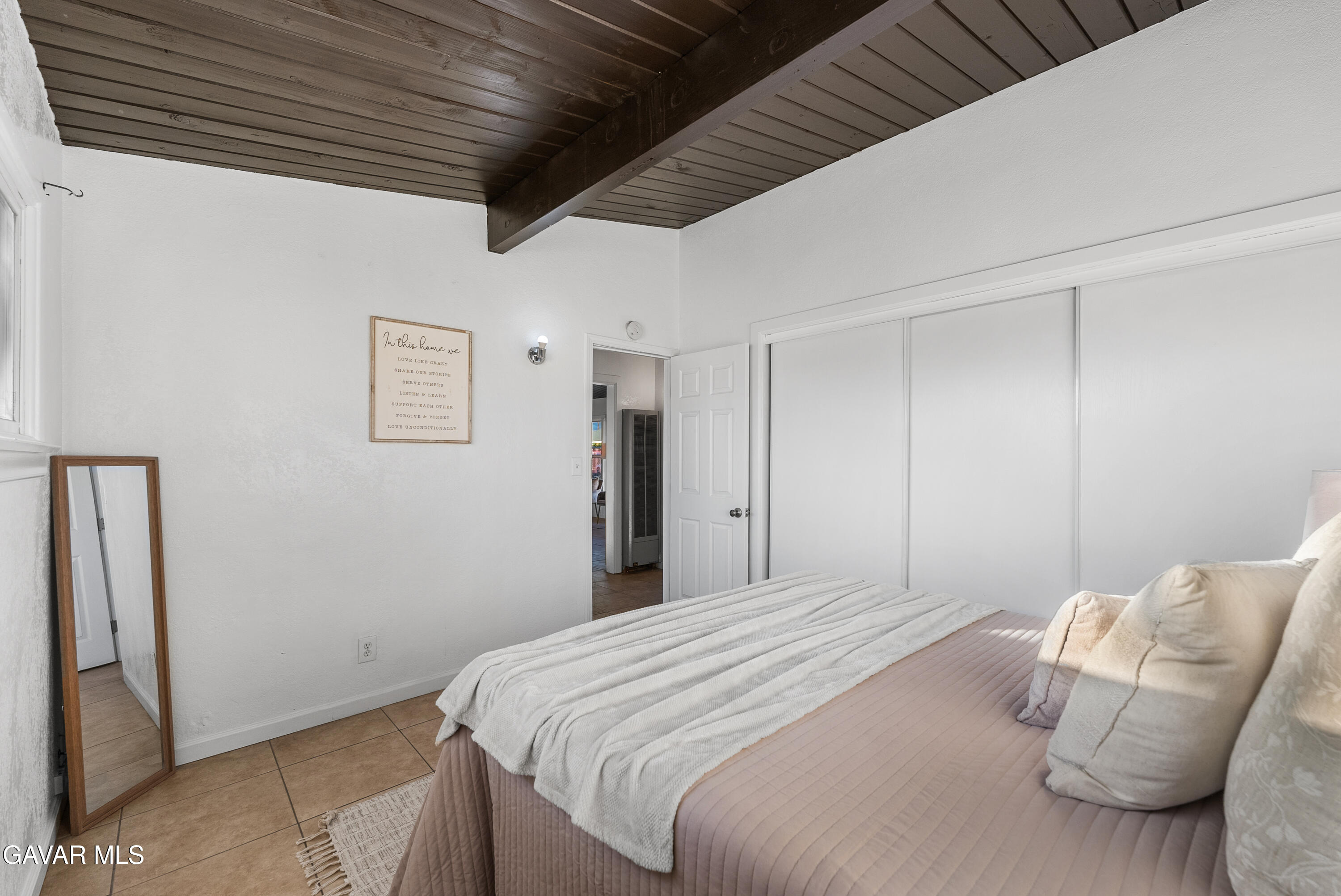 38640 Larkin Avenue Palmdale, CA 93550 - Photo 26 of 38 a bedroom with bed and a walk in closet