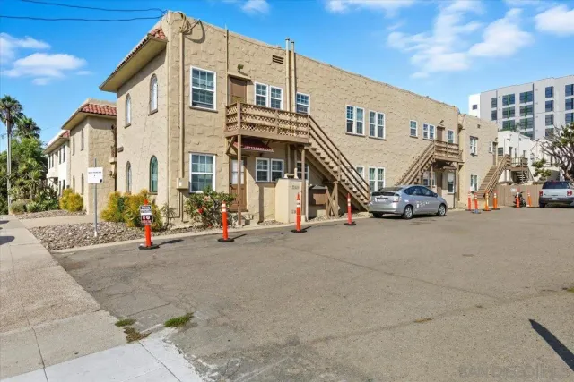 a view of a street with cars