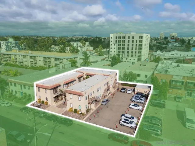 an aerial view of a house with a big yard