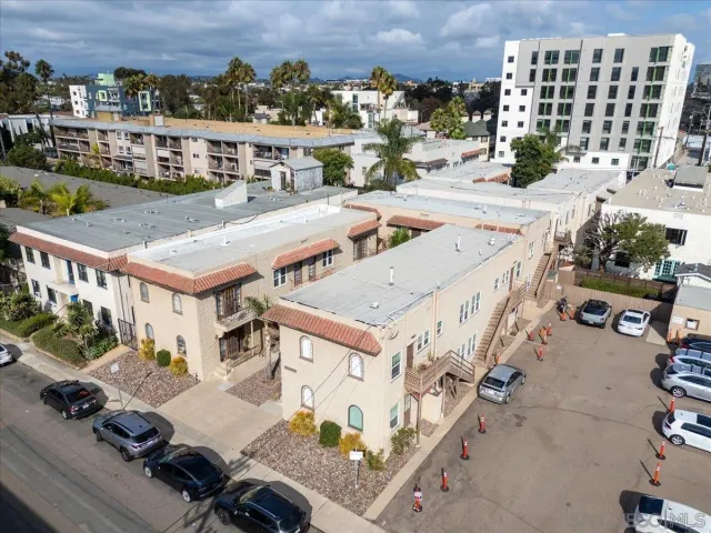 an aerial view of a house with a yard swimming pool and outdoor seating