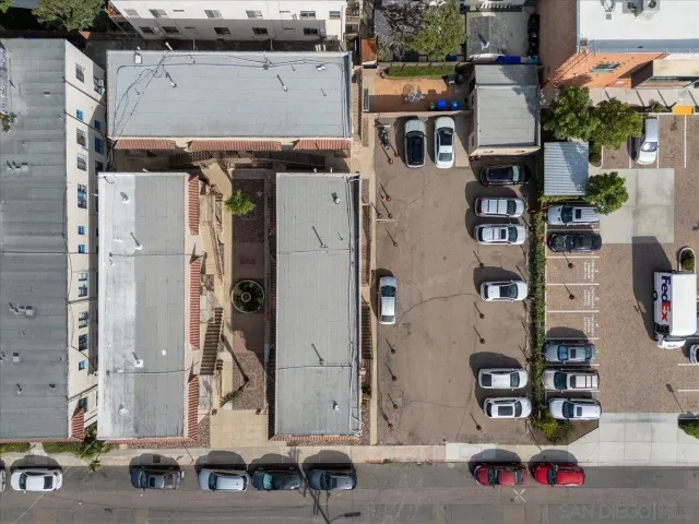 an aerial view of houses with outdoor space