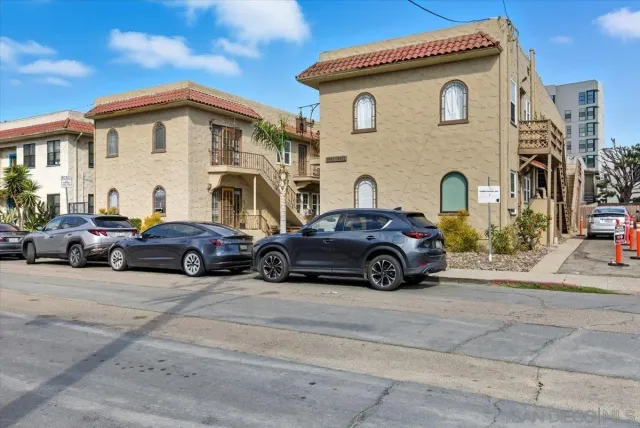 a view of a car parked in front of a house