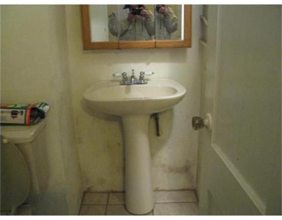 360 Main Street Springfield, MA 01105 - Photo 17 of 23 a bathroom with a sink and mirror