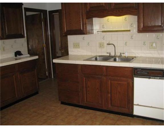 360 Main Street Springfield, MA 01105 - Photo 3 of 23 a kitchen with a sink and cabinets
