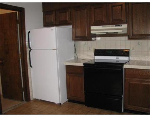 360 Main Street Springfield, MA 01105 - Photo 4 of 23 a kitchen with metallic refrigerator freezer and a dishwasher