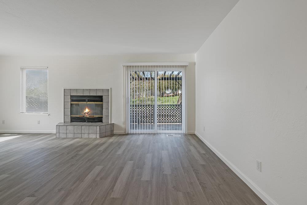 502 Winchester Drive Watsonville, CA 95076 - Photo 11 of 43 a view of wooden floor and windows in a room