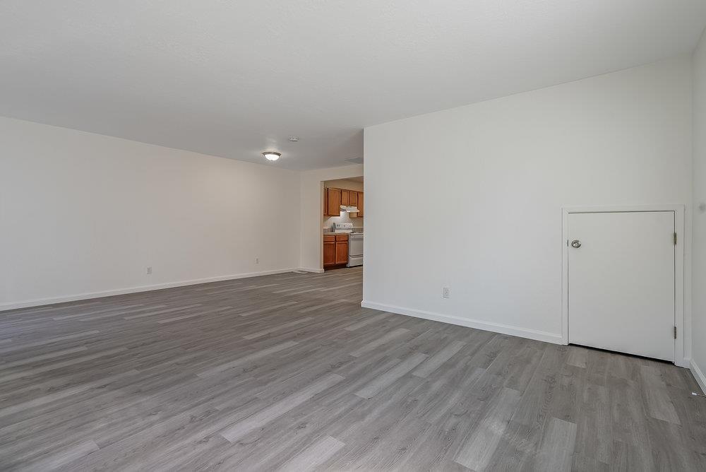 502 Winchester Drive Watsonville, CA 95076 - Photo 15 of 43 a view of an empty room with wooden floor