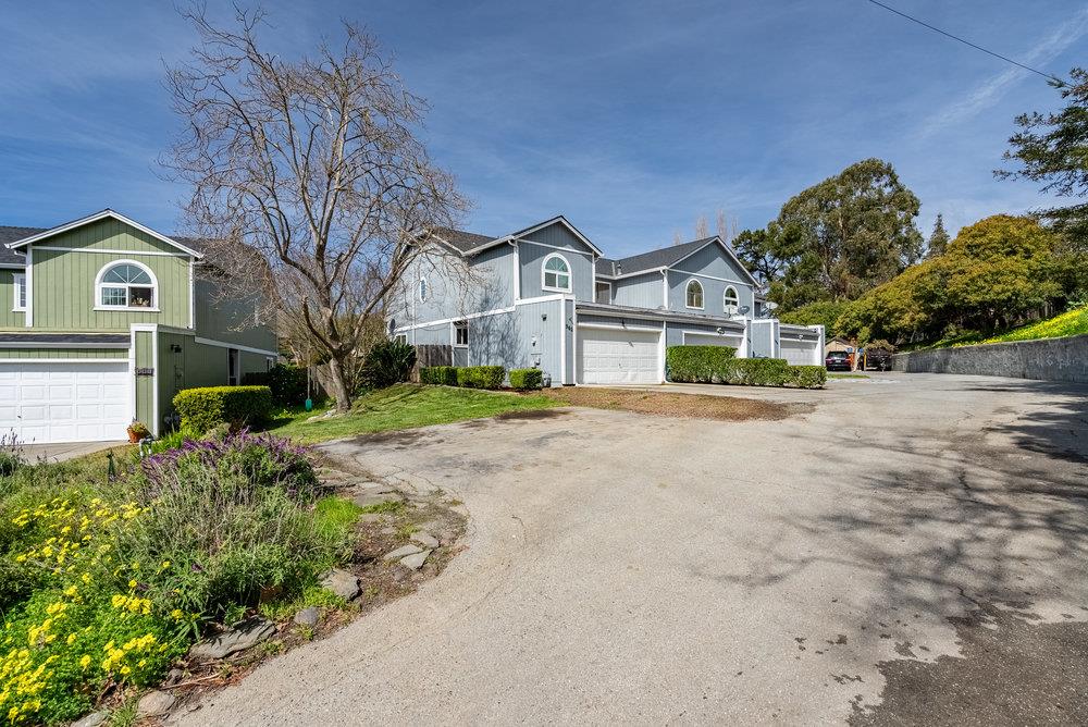 502 Winchester Drive Watsonville, CA 95076 - Photo 2 of 43 a front view of a house with a yard and garage