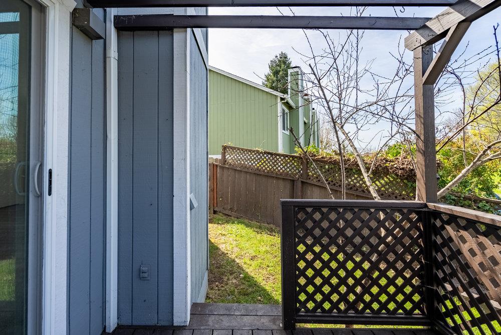 502 Winchester Drive Watsonville, CA 95076 - Photo 38 of 43 a view of a house with wooden fence and trees
