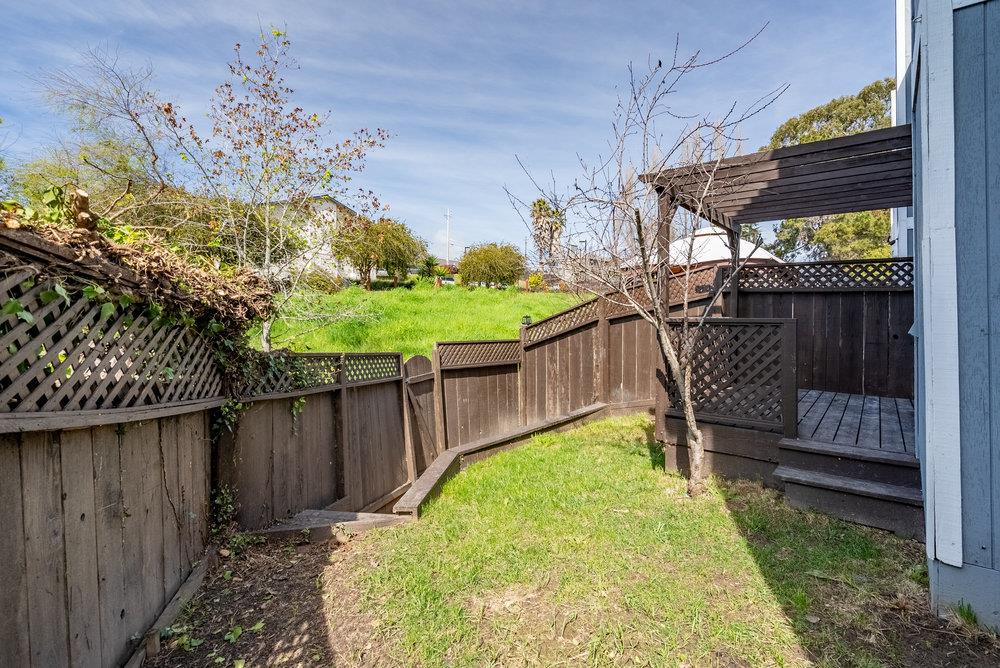 502 Winchester Drive Watsonville, CA 95076 - Photo 40 of 43 a garden view with a wooden fence