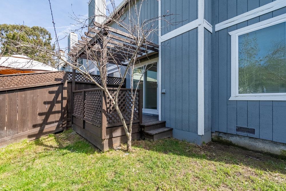 502 Winchester Drive Watsonville, CA 95076 - Photo 41 of 43 a view of a backyard with a small cabin and a chair