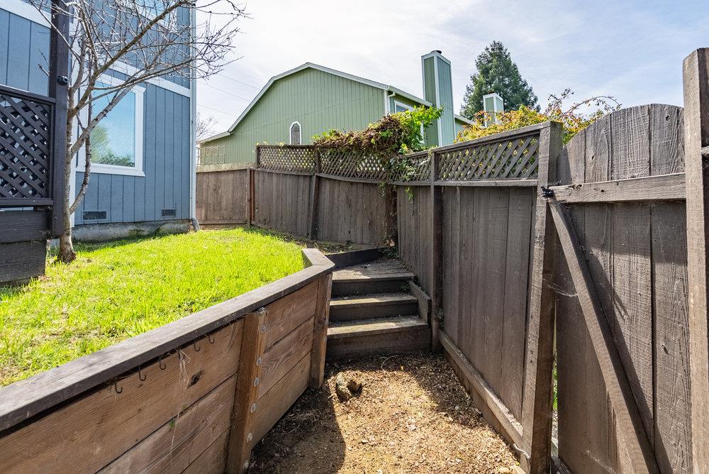 502 Winchester Drive Watsonville, CA 95076 - Photo 42 of 43 a view of balcony with wooden fence and potted plants