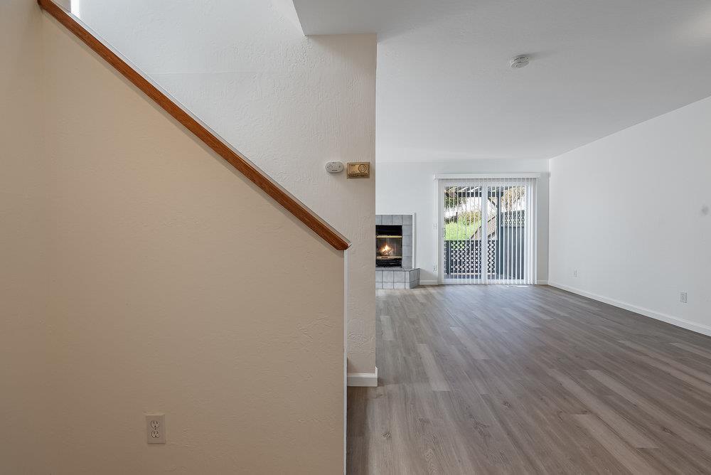 502 Winchester Drive Watsonville, CA 95076 - Photo 8 of 43 a view of empty room with wooden floor and fan