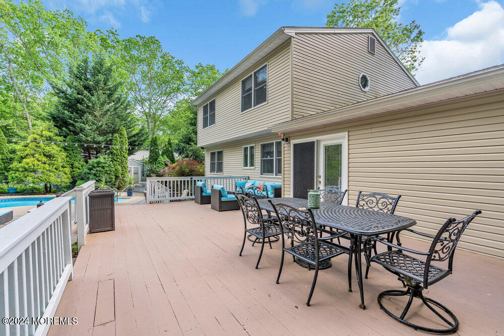 33 Butterfly Road Jackson, NJ 08527 - Photo 15 of 29 a view of a dinning table and chairs in patio of the house
