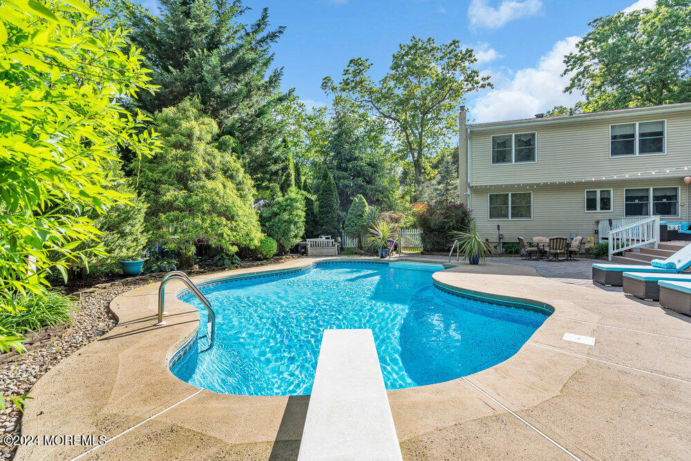 33 Butterfly Road Jackson, NJ 08527 - Photo 18 of 29 a view of a swimming pool with a patio