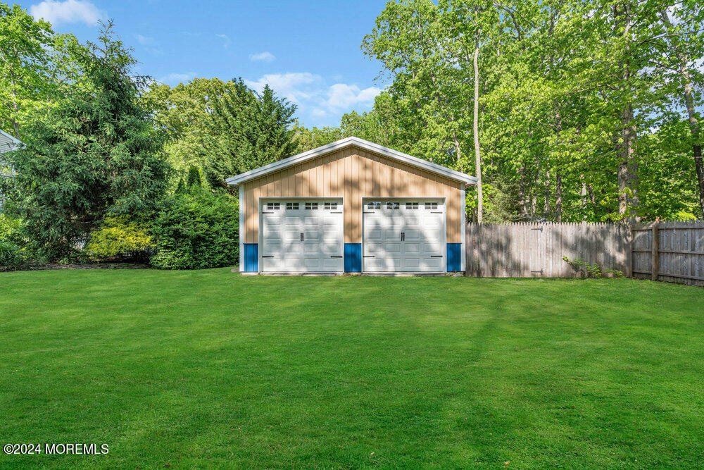 33 Butterfly Road Jackson, NJ 08527 - Photo 25 of 29 a view of a wooden house with a yard