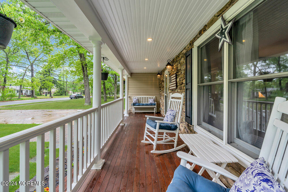 33 Butterfly Road Jackson, NJ 08527 - Photo 7 of 29 a view of balcony with chairs and wooden fence