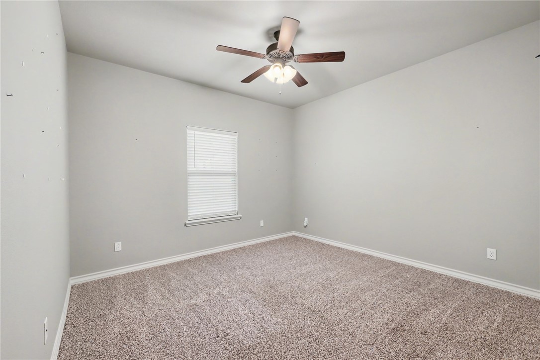 302 Cooper Road, Unit E2 Odem, TX 78370 - Photo 14 of 24 a view of an empty room with a window