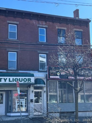 a front view of a building with glass windows