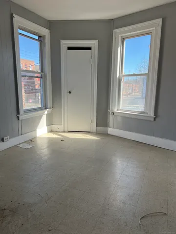 an empty room that has a window