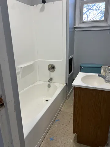 a bathroom with a sink and a bathtub