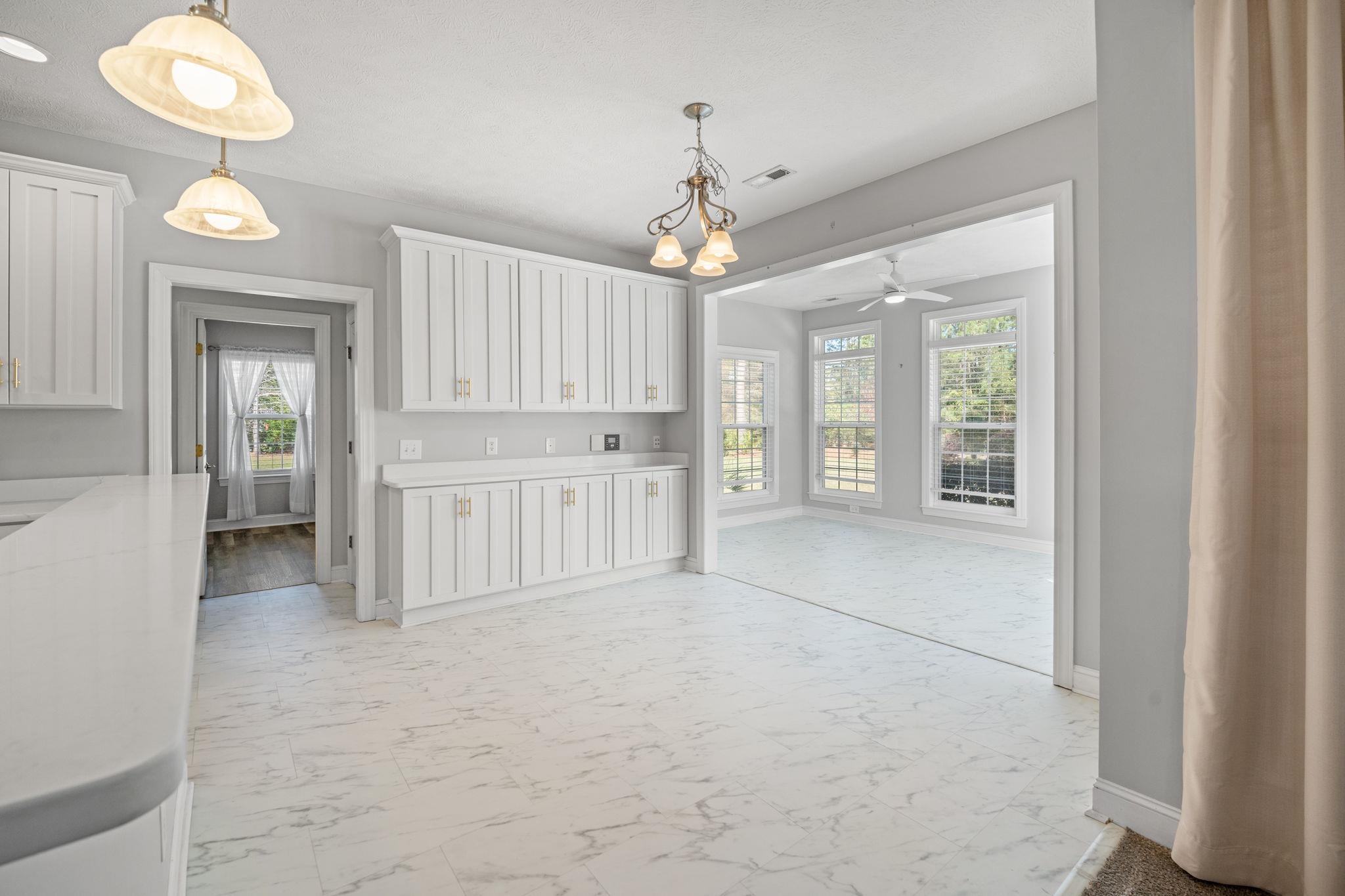 266 Laurel Bay Drive Murrells Inlet, SC 29576 - Photo 10 of 40 Extended Cabinetry & Storage-Breakfast Nook with backyard views & Seamless Living & Dining Flow