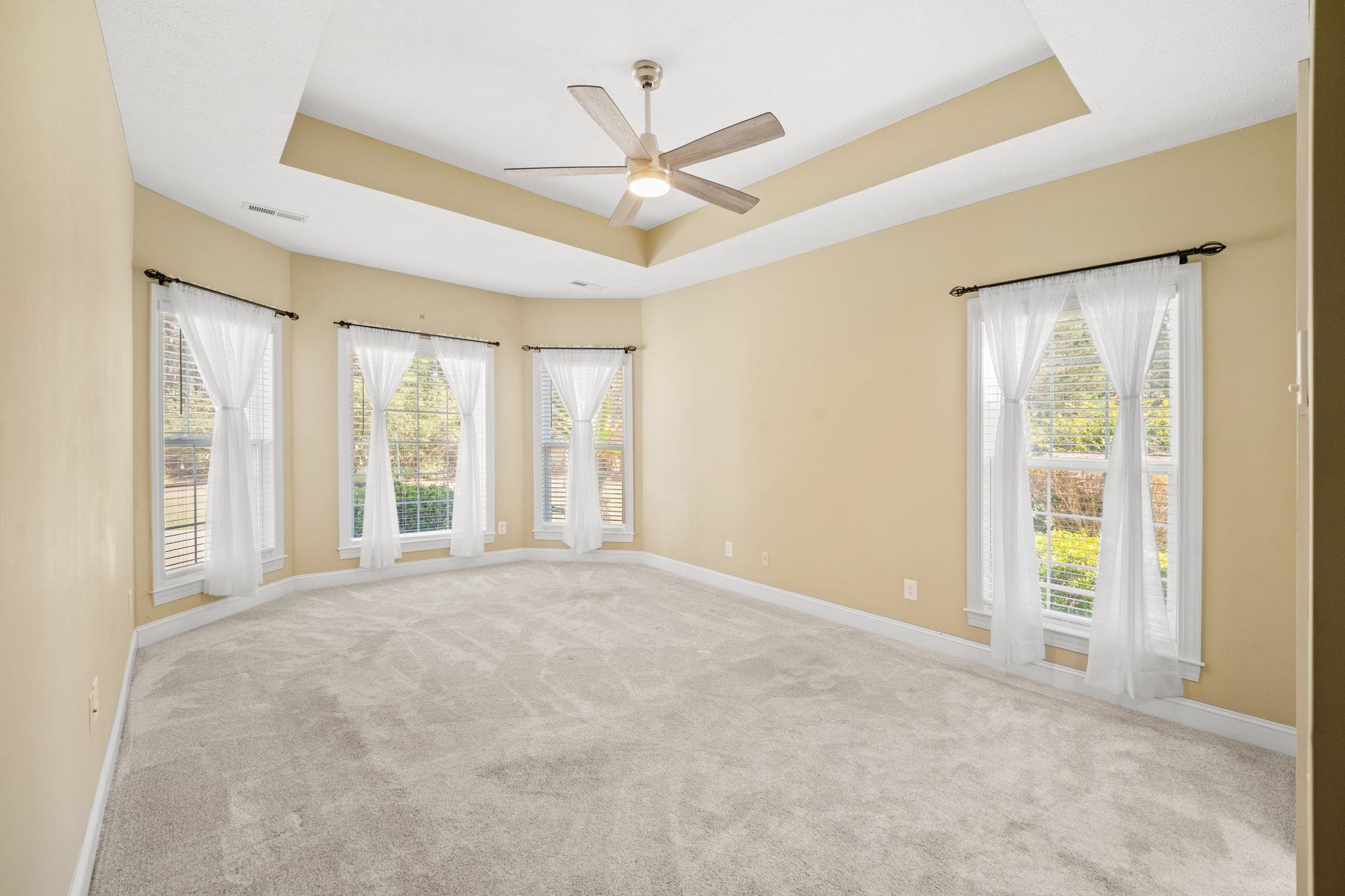 266 Laurel Bay Drive Murrells Inlet, SC 29576 - Photo 14 of 40 Primary Suite with Tray Ceiling & Bay Windows with Natural Light overlooking private backyard