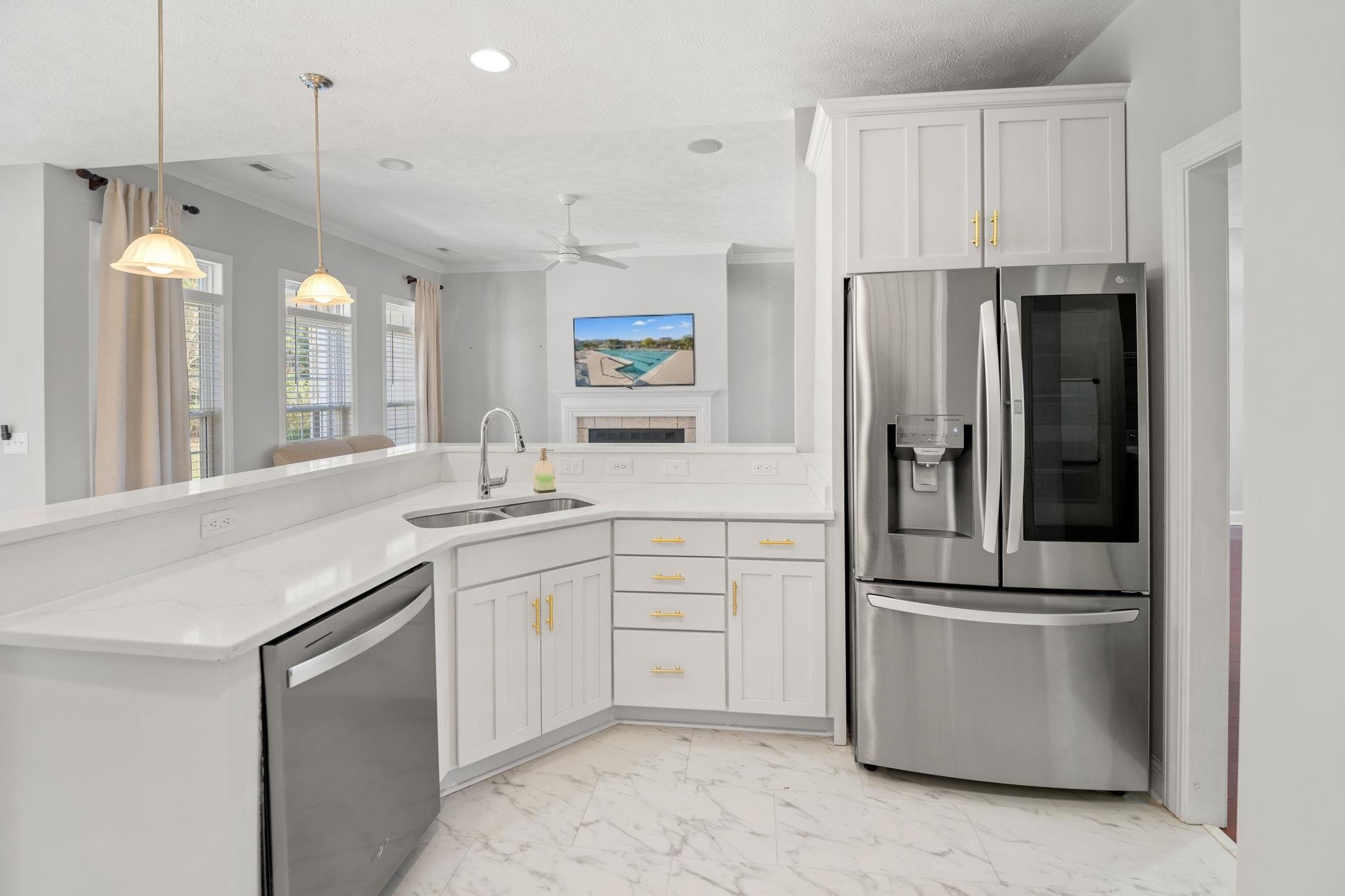 266 Laurel Bay Drive Murrells Inlet, SC 29576 - Photo 8 of 40 Updated Kitchen with White Granite, Open to Living Area and white tile flooring